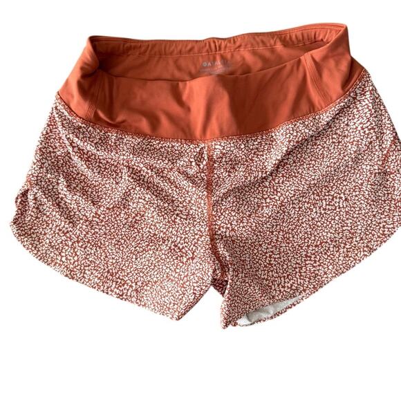 Athleta Pants - ATHLETA run with it 3.5" printed Orange short size small EUC